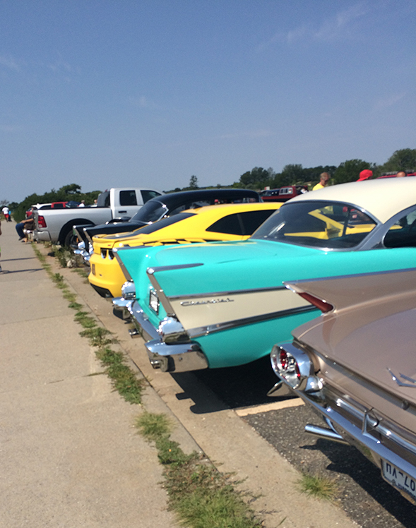 there was a classic car show happening in the beach parking lot