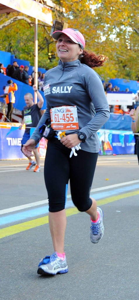2013 crossing the finish line with my throwaway gloves that I couldn't throw away. lol.