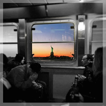 And then captured this shot....all the exhausted, disgruntled commuters inside the boat and the gorgeous colorful sunset and statue right outside the window