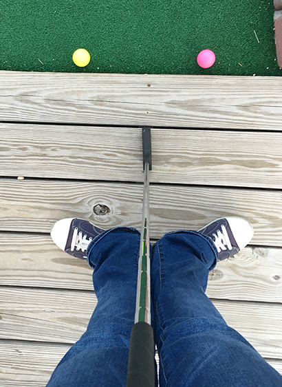Smiley face out of mini-golf equipment